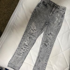 Acid wash ripped jeans
